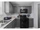 A well-equipped kitchen with modern appliances and gray cabinetry offers ample space at 10312 Gladeview Dr, Indianapolis, IN 46239