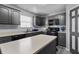 A stylish kitchen featuring grey cabinets, modern appliances, and ample counter space at 10312 Gladeview Dr, Indianapolis, IN 46239
