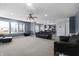 Spacious living room open to the kitchen featuring neutral colors and ample lighting at 10312 Gladeview Dr, Indianapolis, IN 46239