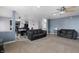 Open-concept living room seamlessly connects to the dining area and kitchen at 10312 Gladeview Dr, Indianapolis, IN 46239