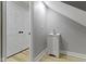 Bathroom with vanity, gray walls, wood floors, white trim, and a closet for all your storage needs at 10398 Ethel St, Carmel, IN 46280