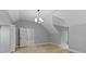Bright bedroom boasts neutral paint, a stylish light fixture, and two closet options at 10398 Ethel St, Carmel, IN 46280