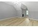 Finished bonus room featuring wood-look floors and freshly painted in neutral gray at 10398 Ethel St, Carmel, IN 46280