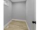 A cozy walk-in closet featuring stylish wood-look floors and a small window at 10398 Ethel St, Carmel, IN 46280