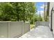 View of the home's painted deck with lattice railing and view of the trees and community at 10398 Ethel St, Carmel, IN 46280