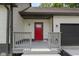 Welcoming front porch and bright red front door and painted trim at 10398 Ethel St, Carmel, IN 46280