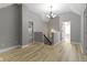 Spacious loft area with a chandelier, staircase, and plenty of room to relax at 10398 Ethel St, Carmel, IN 46280