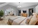 Main bedroom with a lounge area, closet and television, and an ensuite bathroom at 10398 Ethel St, Carmel, IN 46280
