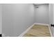 Neutral room with gray walls, white trim, and light wood-look flooring creates a cozy, adaptable space at 10398 Ethel St, Carmel, IN 46280