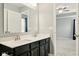 The bathroom includes a double sink vanity and a large mirror for a shared space at 10606 Glenwyck Pl, Noblesville, IN 46060