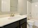 Bathroom featuring a black vanity, bright countertop, chrome faucet and shower-tub combo at 10606 Glenwyck Pl, Noblesville, IN 46060