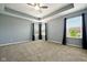 The spacious bedroom includes tray ceilings, a ceiling fan, and neutral walls to easily match your decor at 10606 Glenwyck Pl, Noblesville, IN 46060