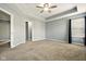 The spacious bedroom includes tray ceilings, a ceiling fan, and neutral walls to easily match your decor at 10606 Glenwyck Pl, Noblesville, IN 46060