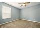 Bedroom featuring gray walls, neutral carpet, ceiling fan, and window with blinds at 10606 Glenwyck Pl, Noblesville, IN 46060