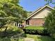 Charming brick home with a well-maintained front yard and inviting entrance at 10712 Downing St, Carmel, IN 46033