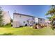 Spacious backyard with a patio, well-maintained lawn, shed, and privacy fence at 10900 Clear Spring Dr, Camby, IN 46113