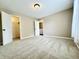 Spacious bedroom with carpet, a closet, and a window that allows natural light to fill the room at 10900 Clear Spring Dr, Camby, IN 46113