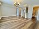 Open bonus room boasting hardwood floors, neutral tones, and natural light, ideal for entertaining or relaxing at 10900 Clear Spring Dr, Camby, IN 46113