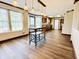 Open dining area featuring pendant lighting, new floors, and bar seating at 10900 Clear Spring Dr, Camby, IN 46113