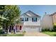 Charming two-story home with vinyl siding, attached garage, and well-maintained landscaping at 10900 Clear Spring Dr, Camby, IN 46113