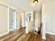 Hallway boasting sleek flooring, neutral walls, and views into the nearby rooms from the second floor at 10900 Clear Spring Dr, Camby, IN 46113