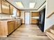 Well-equipped kitchen featuring ample counter space, wood cabinetry, and modern appliances at 10900 Clear Spring Dr, Camby, IN 46113