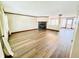 Bright living room featuring new floors, a cozy fireplace, and ample natural light at 10900 Clear Spring Dr, Camby, IN 46113