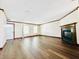 Spacious living room featuring new flooring, fireplace, and classic trim at 10900 Clear Spring Dr, Camby, IN 46113