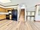 Bright living space with new floors, staircase, and connected kitchen at 10900 Clear Spring Dr, Camby, IN 46113