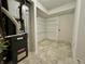 Spacious utility room featuring modern appliances and convenient storage racks for organization and efficiency at 10900 Clear Spring Dr, Camby, IN 46113