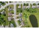 An aerial view of a neighborhood street features manicured lawns and a scenic pond at 11026 Clearspring Way, Indianapolis, IN 46239