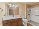 Bathroom featuring a vanity with sink, toilet, and walk-in shower with safety bars at 11026 Clearspring Way, Indianapolis, IN 46239