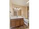 Bright bathroom featuring a vanity, toilet, and accessible walk-in shower with grab bars at 11026 Clearspring Way, Indianapolis, IN 46239