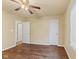 Bedroom with wood flooring, ceiling fan, and views to an adjacent bedroom at 11026 Clearspring Way, Indianapolis, IN 46239