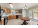 Functional kitchen featuring wood cabinetry, a black appliance package, and abundant counter space at 11026 Clearspring Way, Indianapolis, IN 46239