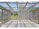 Bright sunroom featuring a glass ceiling, tile flooring, and large windows overlooking the yard at 11026 Clearspring Way, Indianapolis, IN 46239