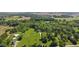 The aerial view showcases the property's large lot and proximity to open fields at 11603 Maze Rd, Indianapolis, IN 46259