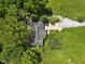 An aerial view showcases the property's sprawling landscape and tree coverage at 11603 Maze Rd, Indianapolis, IN 46259