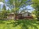 A spacious backyard featuring a wooden deck, perfect for outdoor entertaining at 11603 Maze Rd, Indianapolis, IN 46259