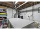 Unfinished basement space featuring open ceiling and utilities, offers potential for customized renovation and added storage at 11603 Maze Rd, Indianapolis, IN 46259