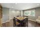 Charming dining room with hardwood floors, square wood table and plenty of natural light at 11603 Maze Rd, Indianapolis, IN 46259