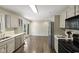 Kitchen with stainless steel appliances and access to the backyard at 11603 Maze Rd, Indianapolis, IN 46259