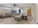 Living room with a large sectional, and wood-look flooring at 11603 Maze Rd, Indianapolis, IN 46259