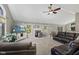 Inviting living room with a modern fireplace, plush leather seating, and natural lighting at 11603 Maze Rd, Indianapolis, IN 46259