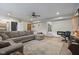 Spacious living room featuring a fireplace, TV and a sectional at 11603 Maze Rd, Indianapolis, IN 46259