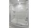 Bright bathroom shower with a curved glass door at 11603 Maze Rd, Indianapolis, IN 46259