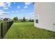 Expansive backyard featuring well-maintained lawn and classic black fence, great for outdoor enjoyment at 11809 Redpoll Trl, Noblesville, IN 46060