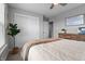 Bedroom featuring neutral decor, a plush carpet, double closets, and a green houseplant at 11809 Redpoll Trl, Noblesville, IN 46060