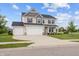 Two story home with three car garage and well manicured lawn on a sunny day at 11809 Redpoll Trl, Noblesville, IN 46060