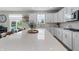 Bright kitchen showcasing a large island with seating and ample countertop space at 11809 Redpoll Trl, Noblesville, IN 46060